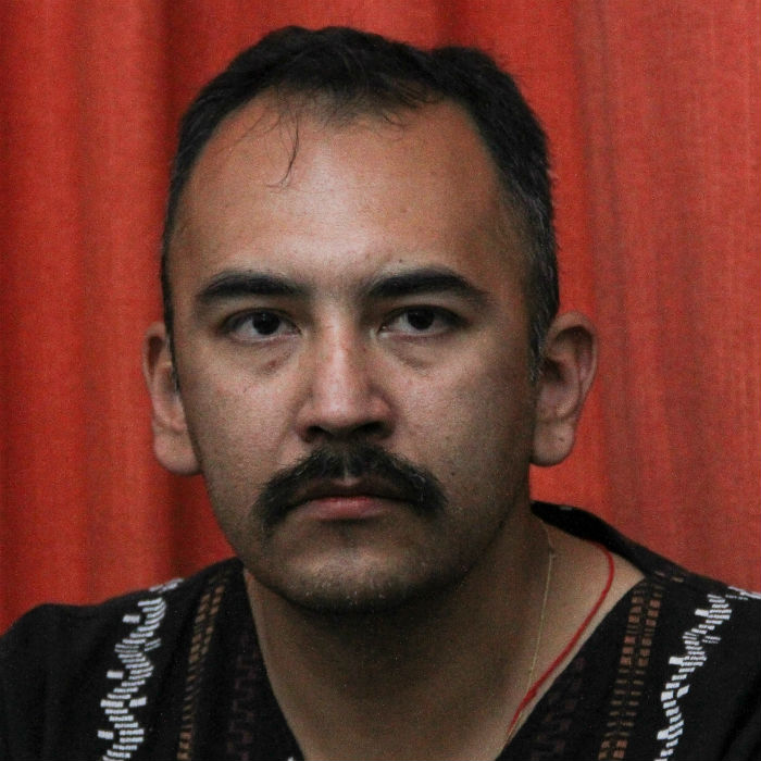 El activista Juan Carlos Flores Solís durante la conferencia después de 10 mesas de estar encarcelado. Foto: Cuartoscuro