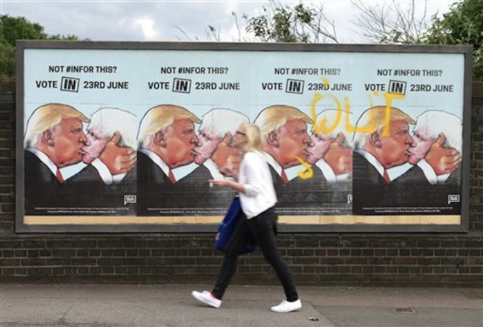 Una Mujer Camina Frente a Carteles a Favor De Votar Por La Permanencia De Gran BretaÒa En La UniÛn Europea En Londres De Juniio De En El Cartel Aparece El Candidato Republicano Estadounidense Donald Trump Besando Al Principal Partidario De La Salida Britnica Boris Johnson yui Mok Pa Via Ap United Kingdom out No Sales No Archives