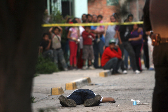 En al menos 14 homicidios se utilizó un arma de fuego. Foto: Cuartoscuro/Archivo. 